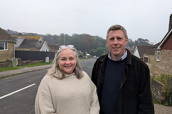 James out and about, on a suburban pavement with Councillor Lesley Boniface.