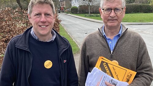 James MacCleary and Daniel Stewart-Roberts with a rural street in the background