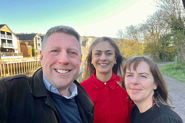 James taking an outdoor selfie with two staff from Lewes Citizens Advice Bureau.